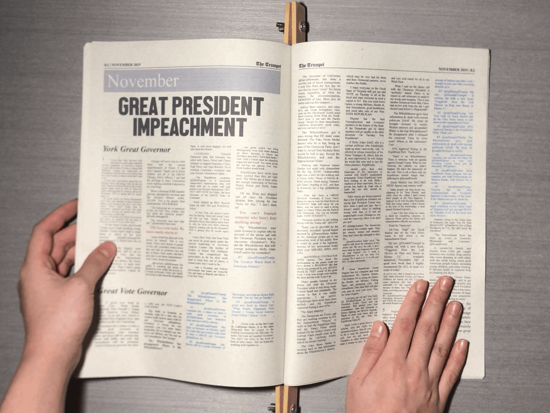 Photograph of The Trumpet newspaper opened to the November section, with a headline reading 'GREAT PRESIDENT IMPEACHMENT'.