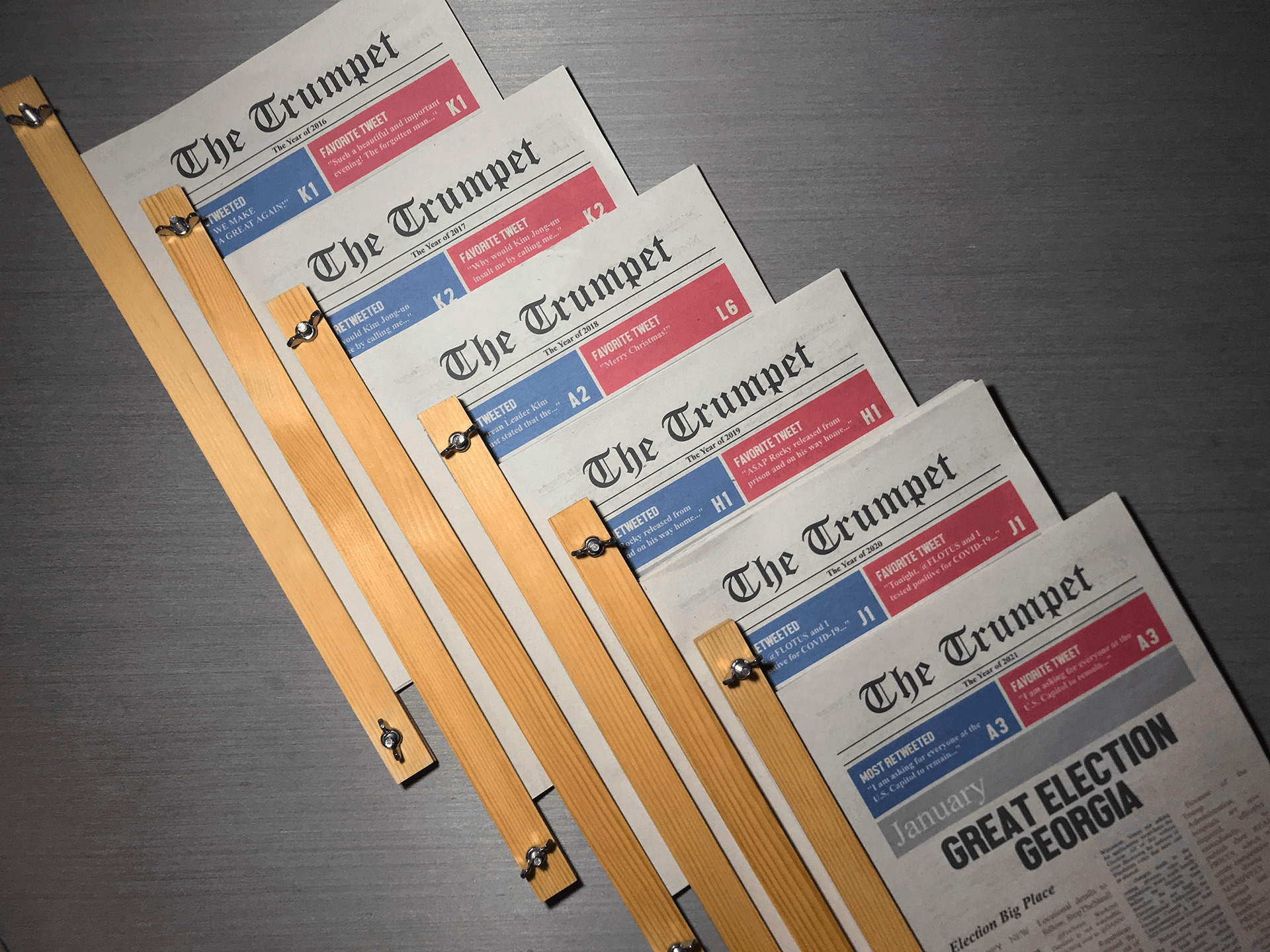 Photograph of the six yearly editions of The Trumpet.